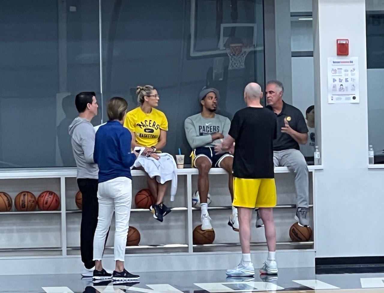 Tyrese Haliburton with members of the front office at a draft workout.