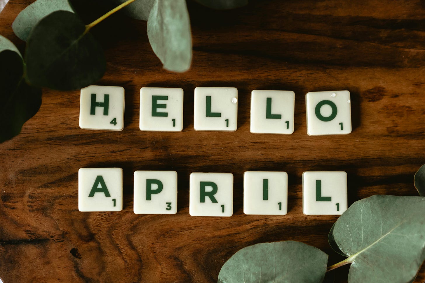 Scrabble letters spell "Hello April"