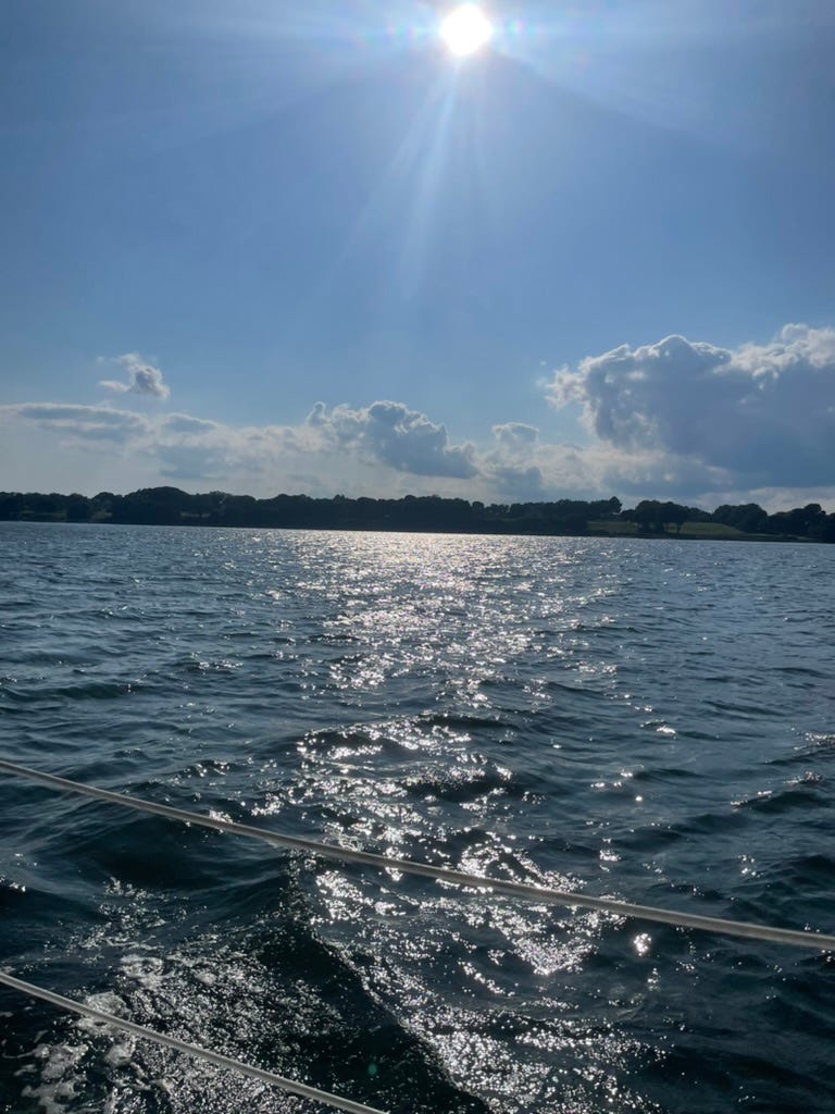 Late afternoon sky on the ocean as seen from a boat.