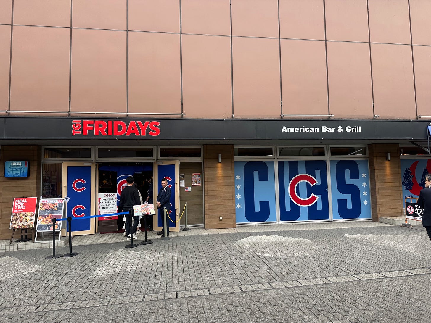 The TGI Fridays next to the Tokyo Dome adorned with huge CUBS signage and the "C" logo