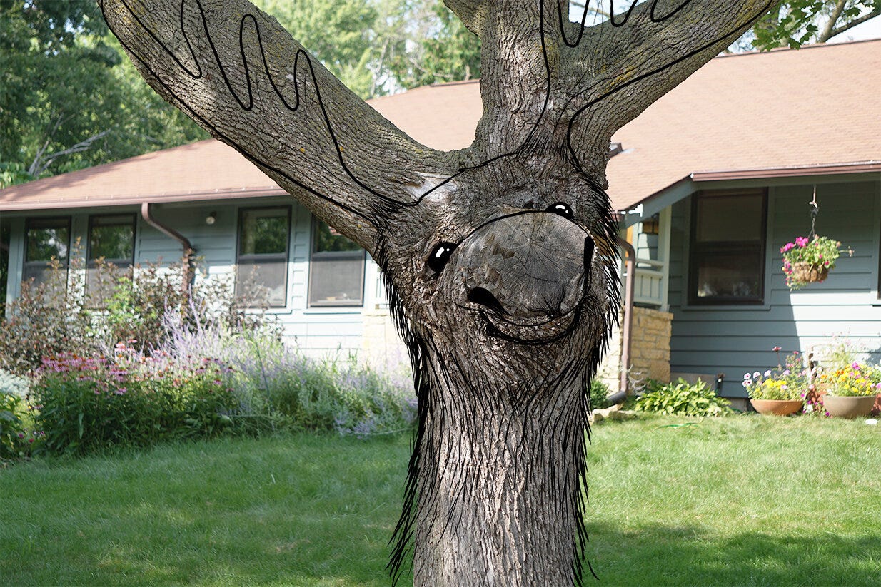 an illustration of a moose overlaid onto the trunk of a tree with a house and flower filled garden in the background