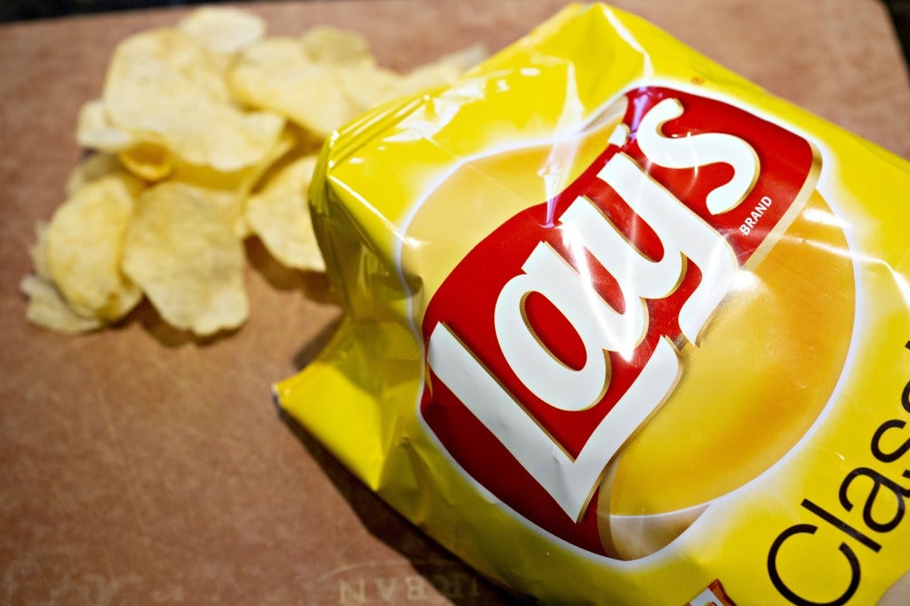 Frito-Lay is voluntarily recalling batches of its 13-ounce bags of potato chips.