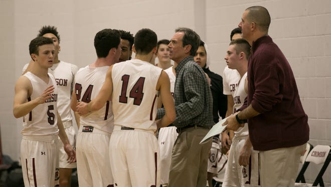 Eddie Franz gives instructions to the Morristown-Beard boys basketball team during the season opener.