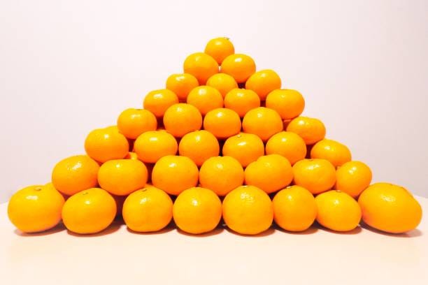 260+ Orange Stack Pyramid Shape Fruit Stock Photos, Pictures ...