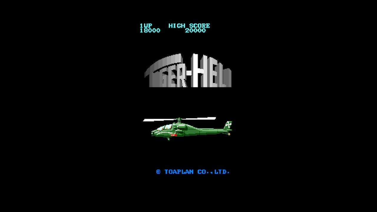 A screenshot of the M2 Toaplan Arcade Garage edition title screen for Tiger-Heli, which features the game's warped font logo in a reflective silver, with the green attack helicopter underneath. The high score info and Toaplan's credit are found below.