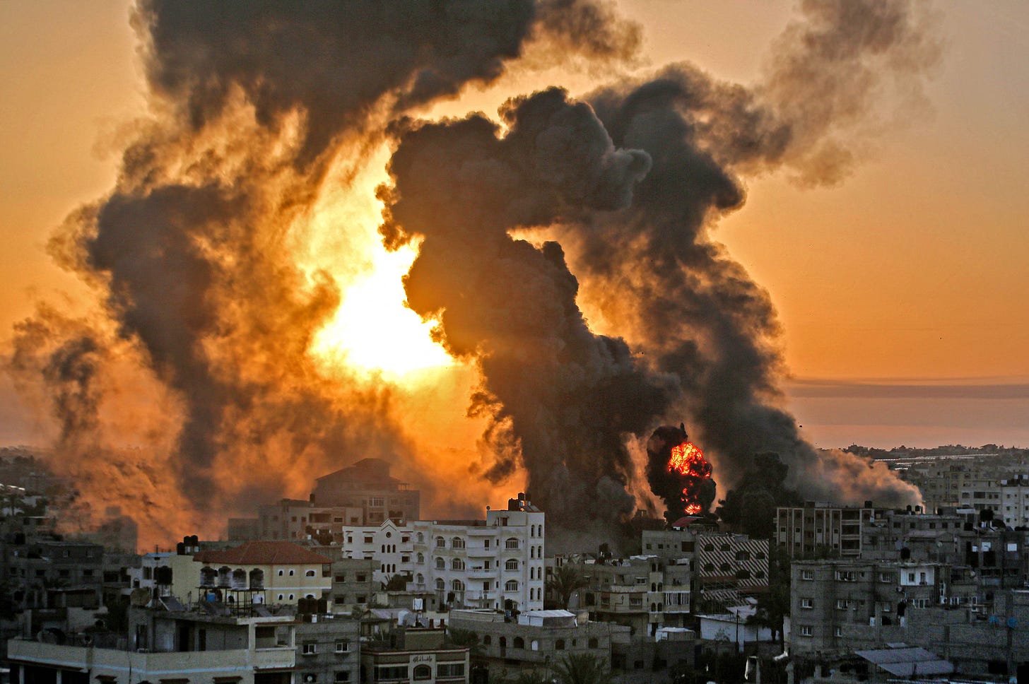 A fire rages at sunrise in Khan Yunish following an Israeli airstrike on the Gaza strip on Wednesday morning