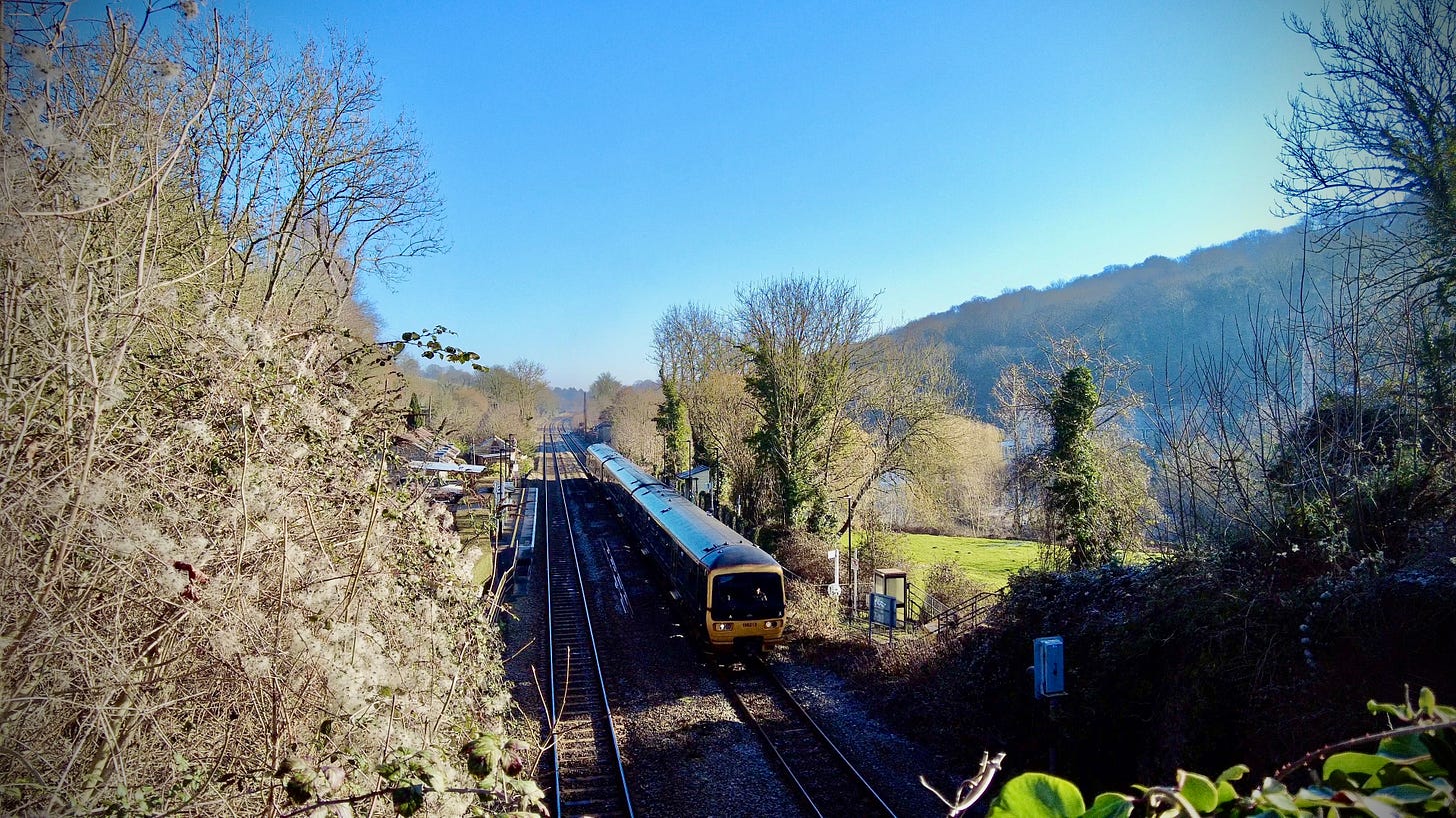 A GWR passenger train stopped for a passenger at Avoncliff Station in the lovely February winter sunshine.