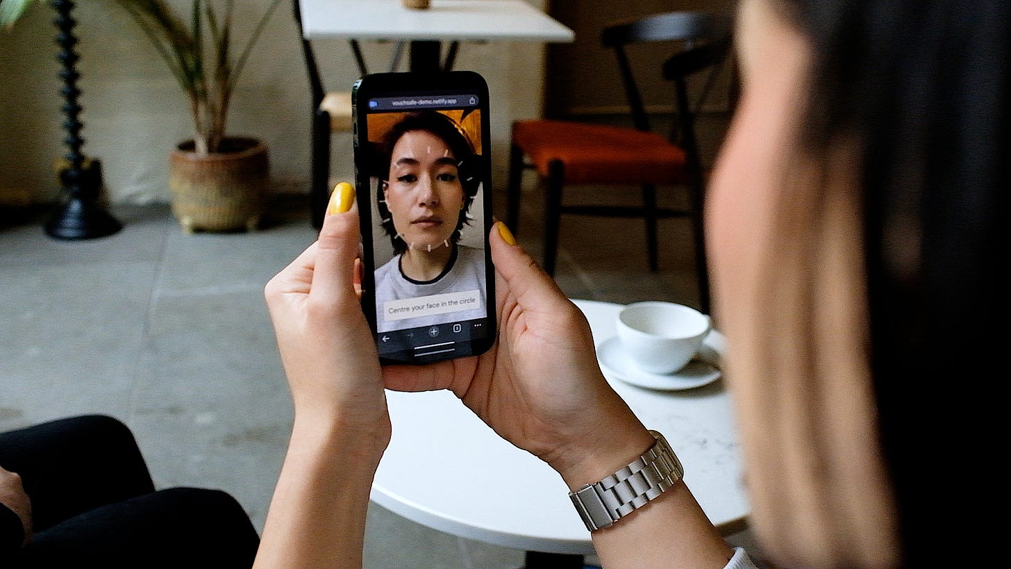 A Vouchsafe mobile user taking a selfie with the help of an on-screen circle.