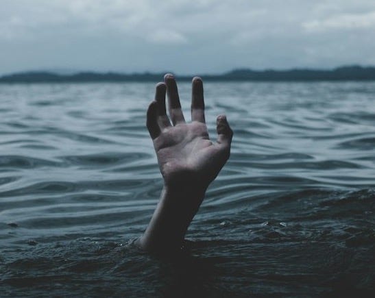 a person drowns underwater a person drowns underwater
