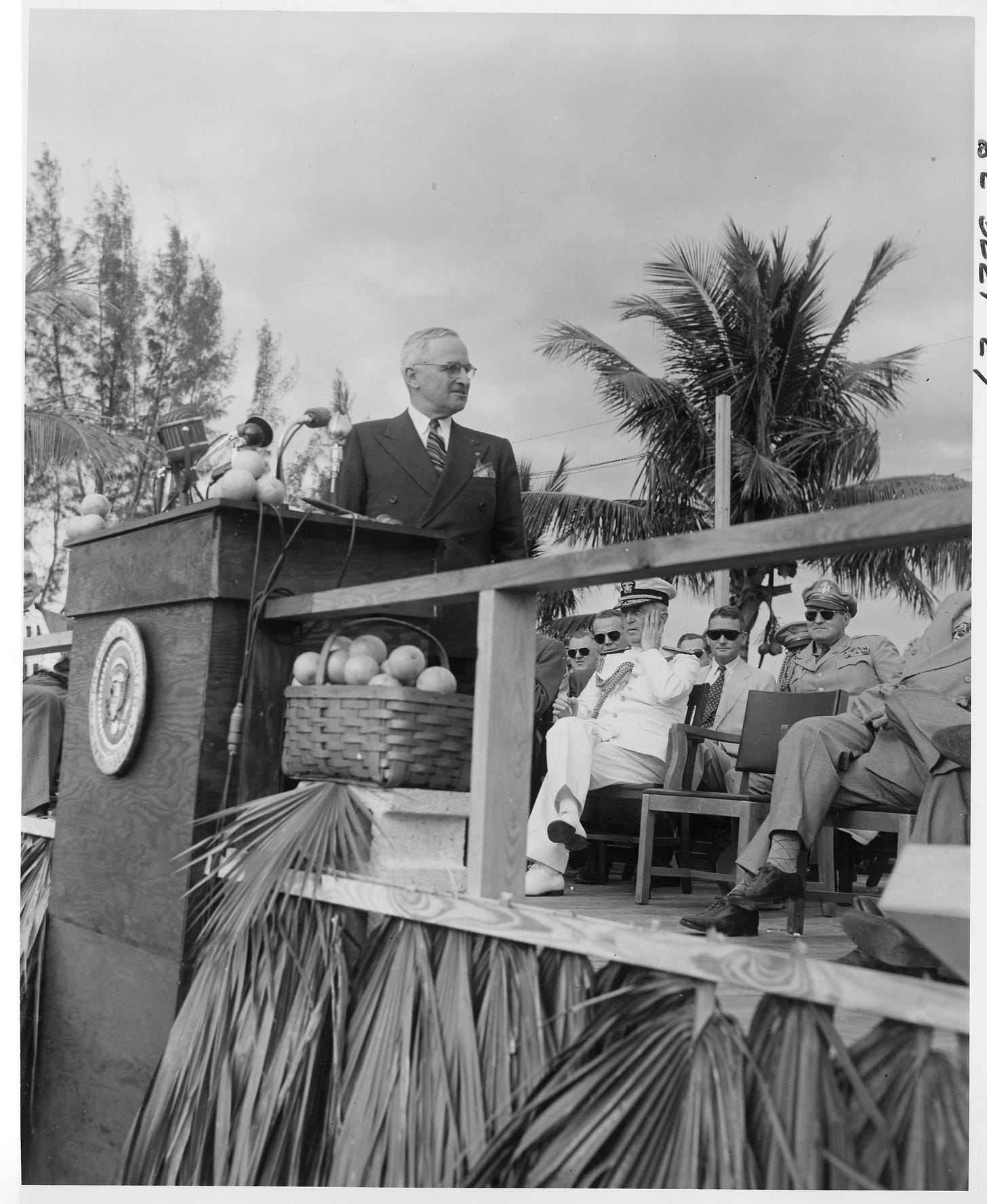 president truman with dignitaries behind him dedicating everglades national park, a palm tree in background