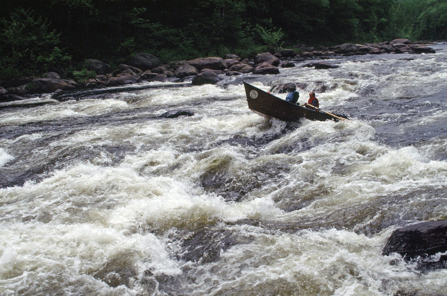 Two boaters take a dory down the Hudson River in whitewater conditions. This photo is part of the soon-to-be public Gary Randorf Photo Archive - Gary Randorf/Adirondack Council