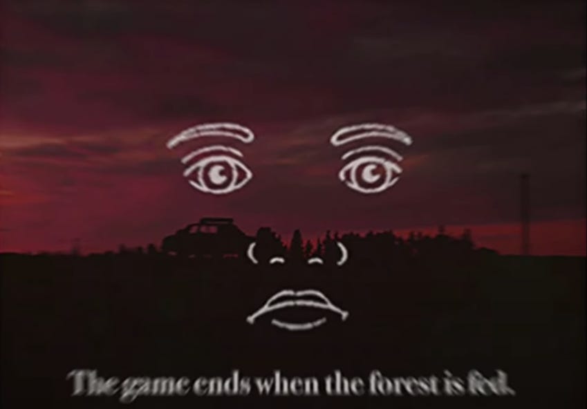 A picture of a forest at sunset, overlayed with a strange drawing of a face in white. Blurry text at the bottom of the screen reads "the game ends when the forest is fed."