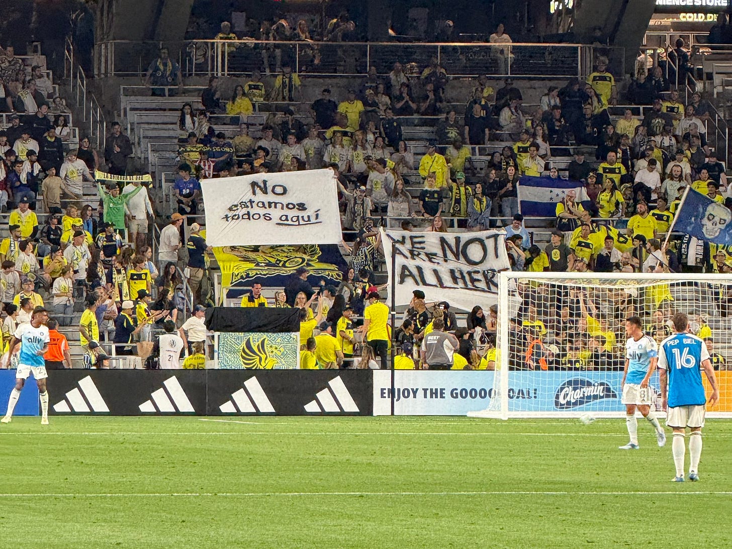 “We are not all here” banner 

Photo Courtesy Carolina Hooliganz