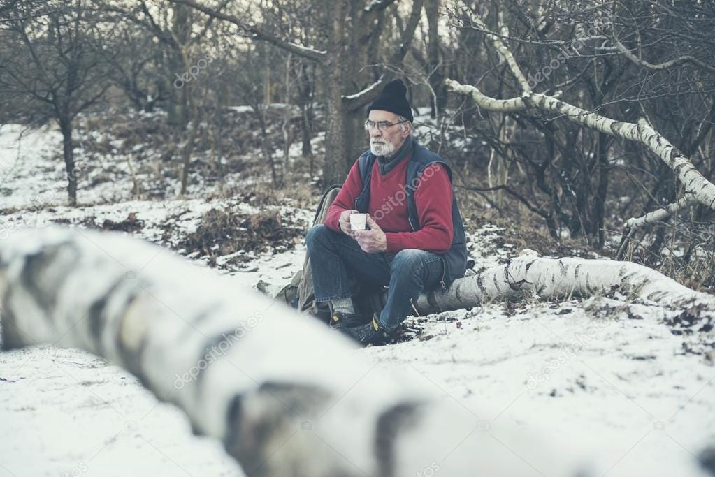 Elderly man in a snowy winter forest Stock Photo by ©ysbrand 65074453