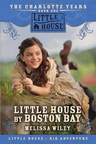 little house by boston bay cover, a young girl laying on her stomach in the grass