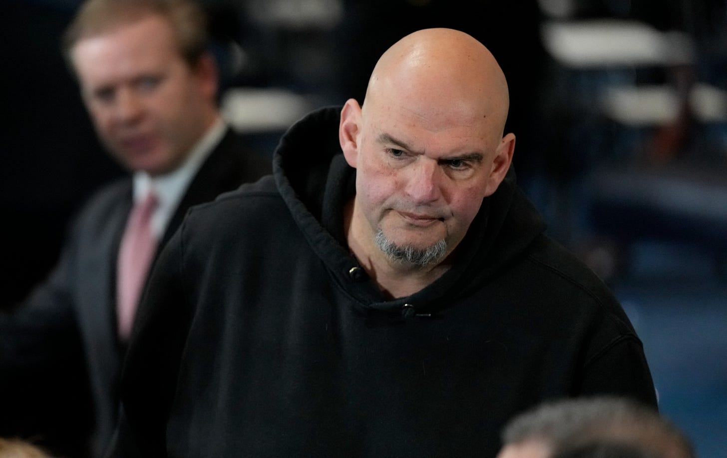 Senator John Fetterman, Democrat of Pennsylvania, arrives before the 60th Presidential Inauguration in the Rotunda of the U.S. Capitol in Washington, Monday, Jan. 20, 2025.