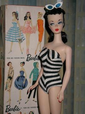 A doll in a bathing suit

Description automatically generated