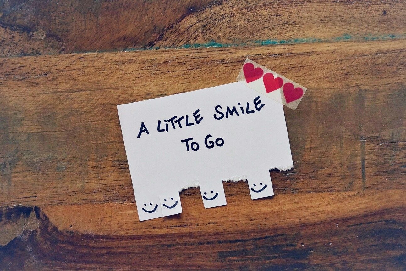 a paper with smiles for people to take with them when they go a paper with smiles for people to take with them when they go