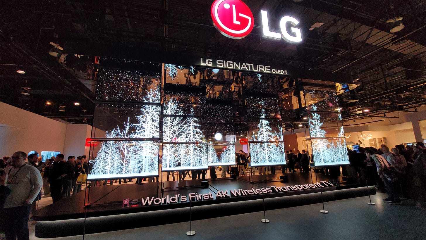 A moving display of 20 transparent screens on the LG stand, showing snow covered trees