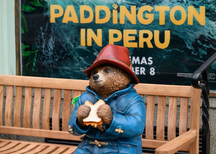 Paddington bear eating a marmalade sandwich