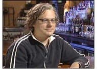 A person sitting at a bar

Description automatically generated