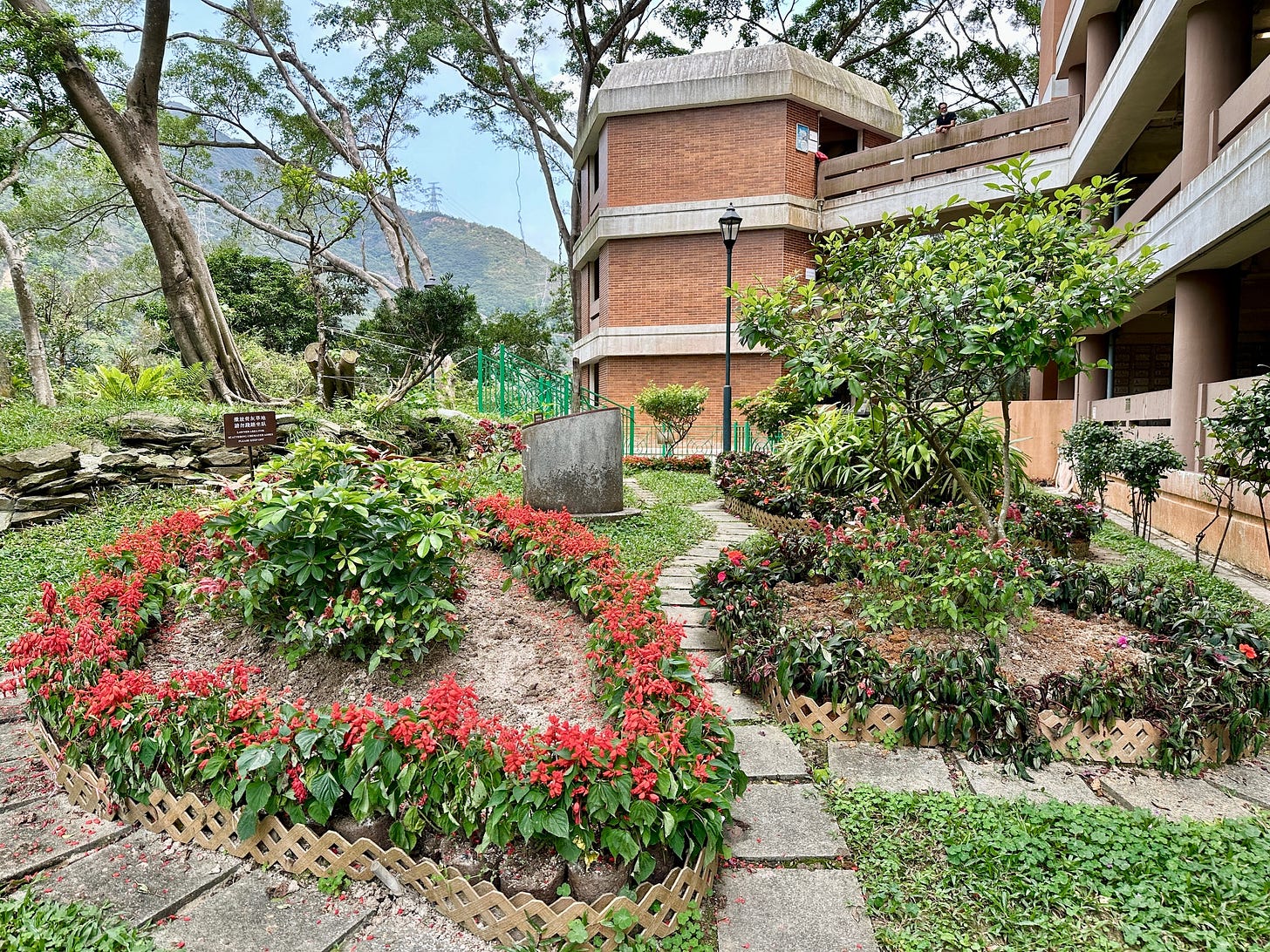 A garden outside a columbarium, with a mountain in the background