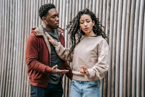 Free Frustrated multiethnic couple having argue on street Stock Photo