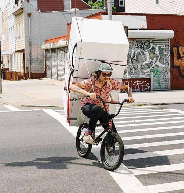 Attention Stopper | Man Hauling Refrigerator on Bicycle on City Streets ...