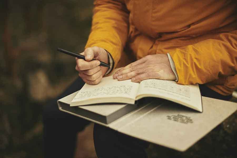 woman writing in a journal