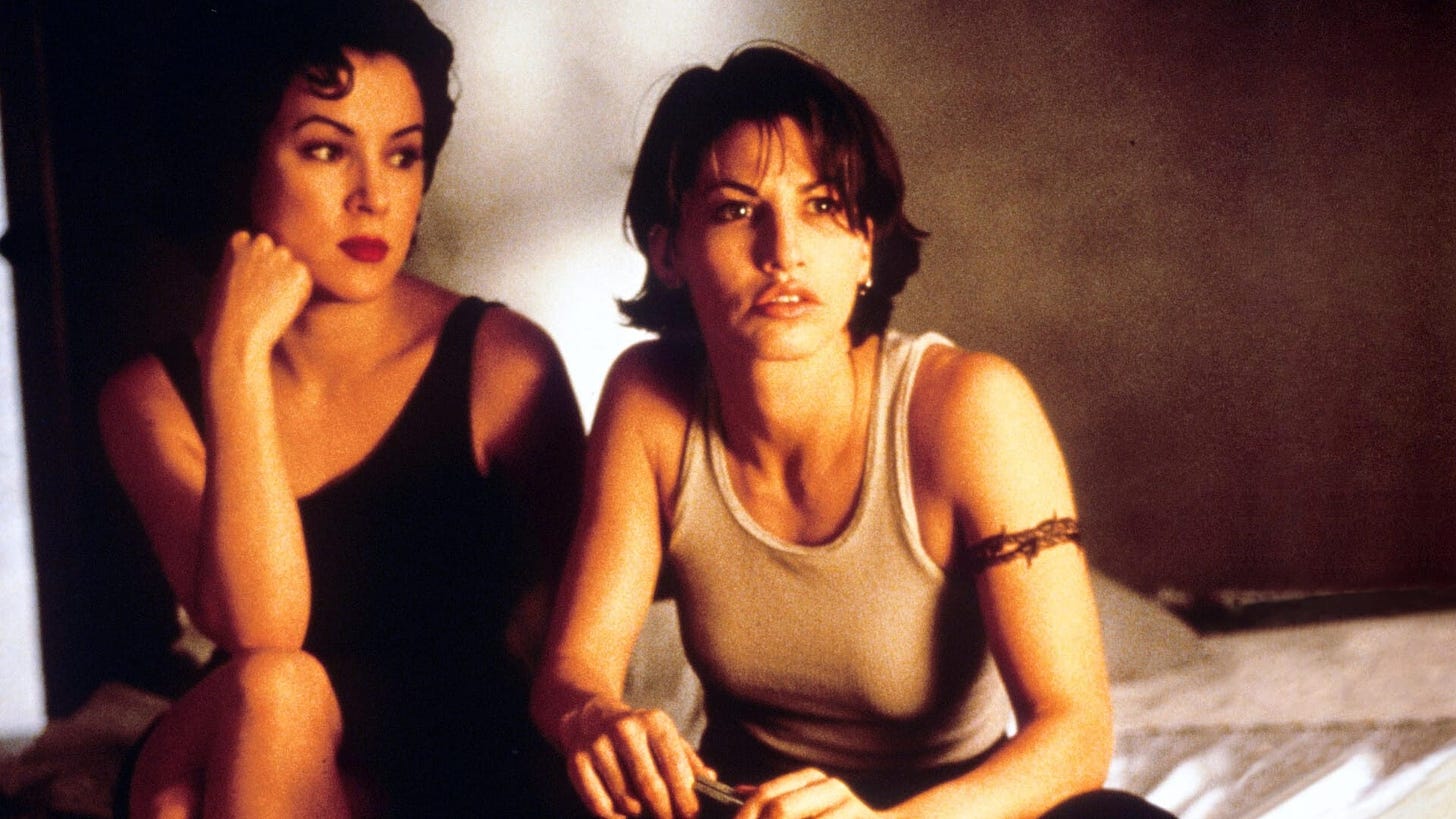 A still from Bound, directed by Lilly and Lana Wachowski featuring Jennifer Tilly and Gina Gershon.