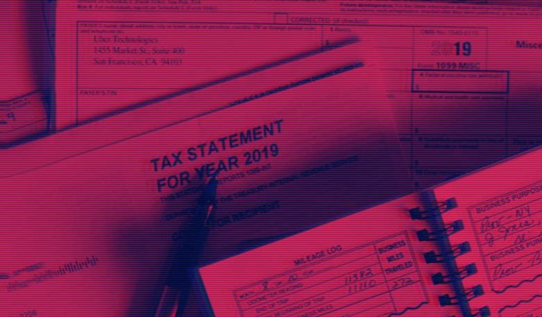 A tax form with a pen and a notepad

Description automatically generated