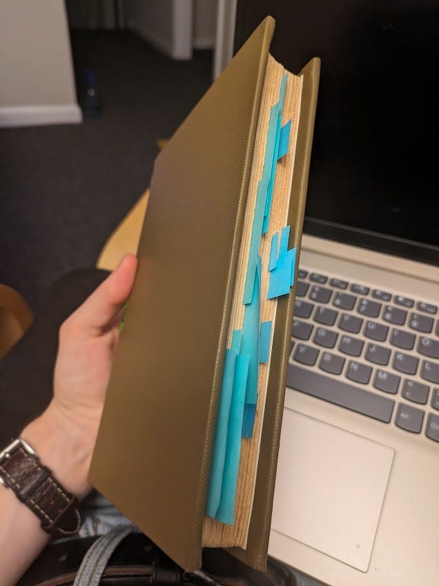 a book with lots of sticky notes in it