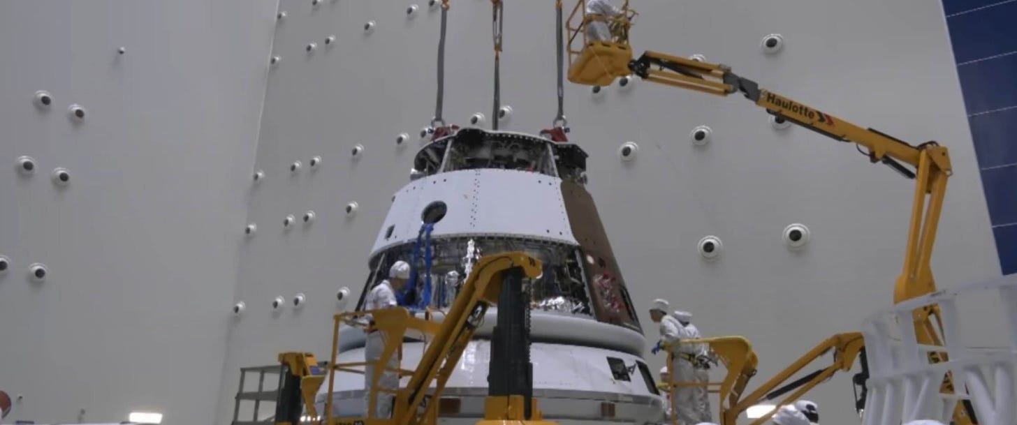 The Mengzhou capsule undergoing hardware installation and outfitting.