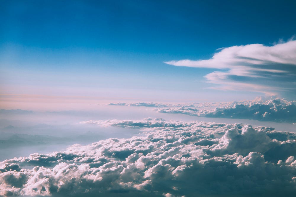 Bright blue sky with clouds.