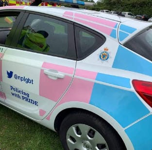 A car with a pink and blue stripe

Description automatically generated