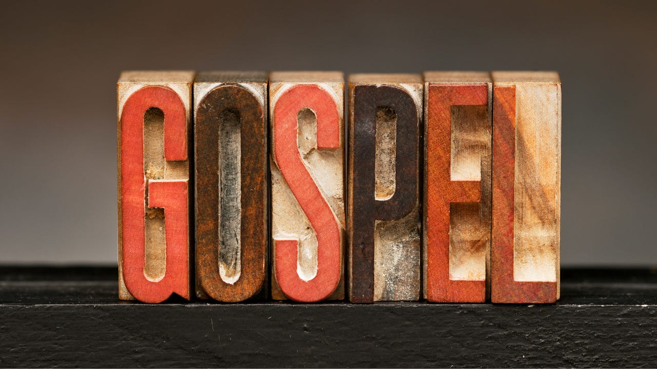 The word "Gospel" in wooden block letters.