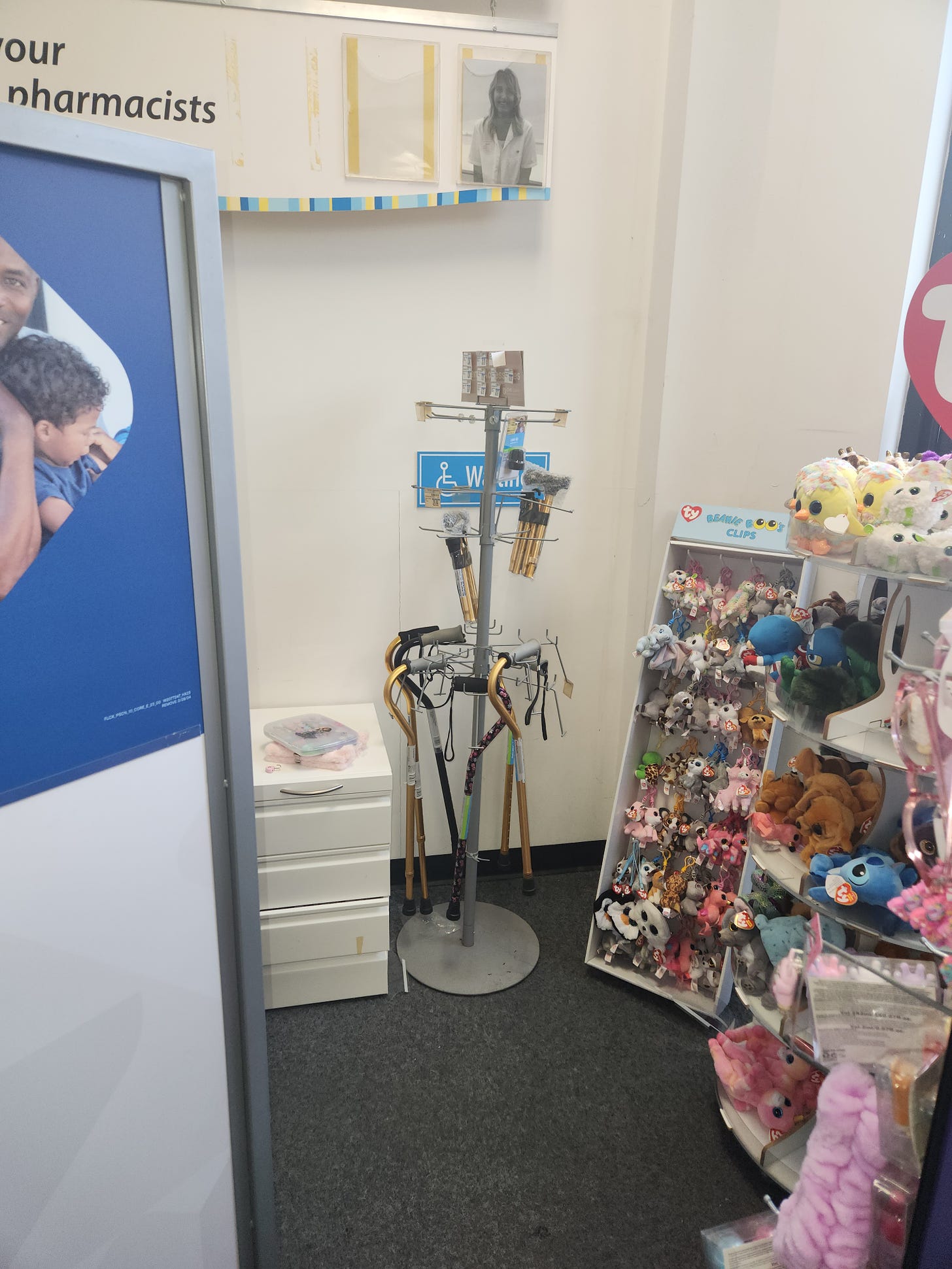 image of a pharmacy consult area for people with disabilities, but blocked with merchandise and other items.