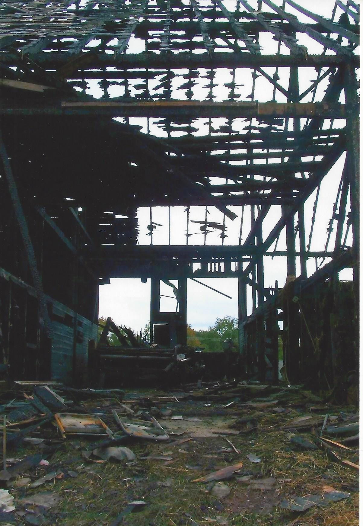 An interior photo of a barn destroyed by a fire