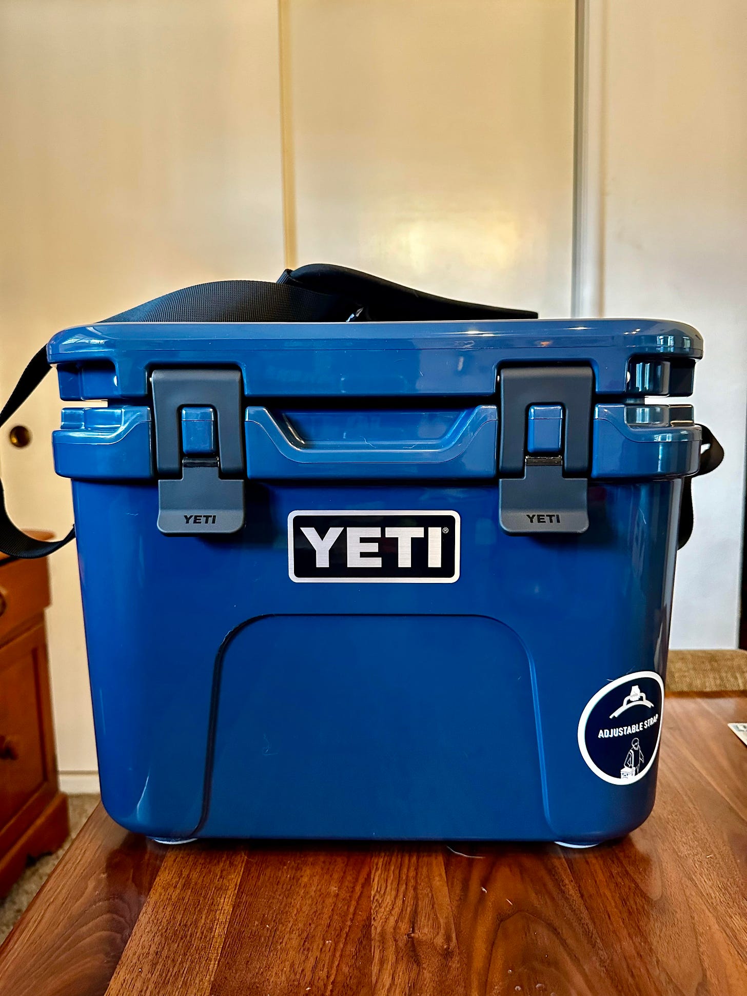 Navy blue Yeti Roadie 24 cooler sitting on a table