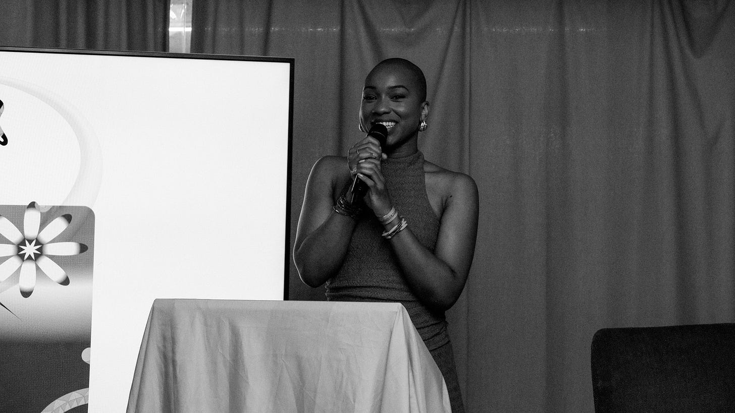 Photograph of Olivia Ema speaking on a stage