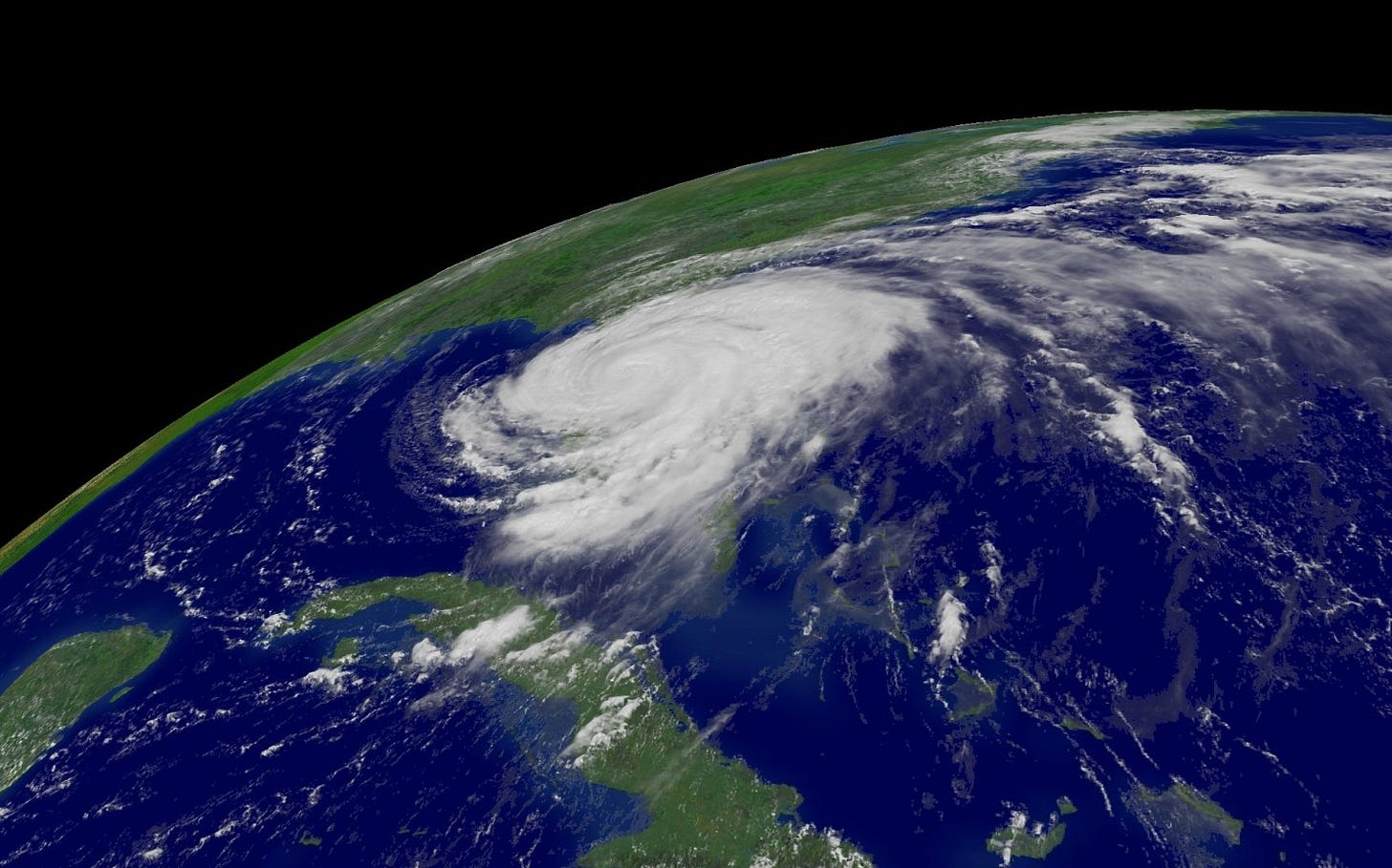 a satellite image shows a large hurricane swirl over the state of Florida
