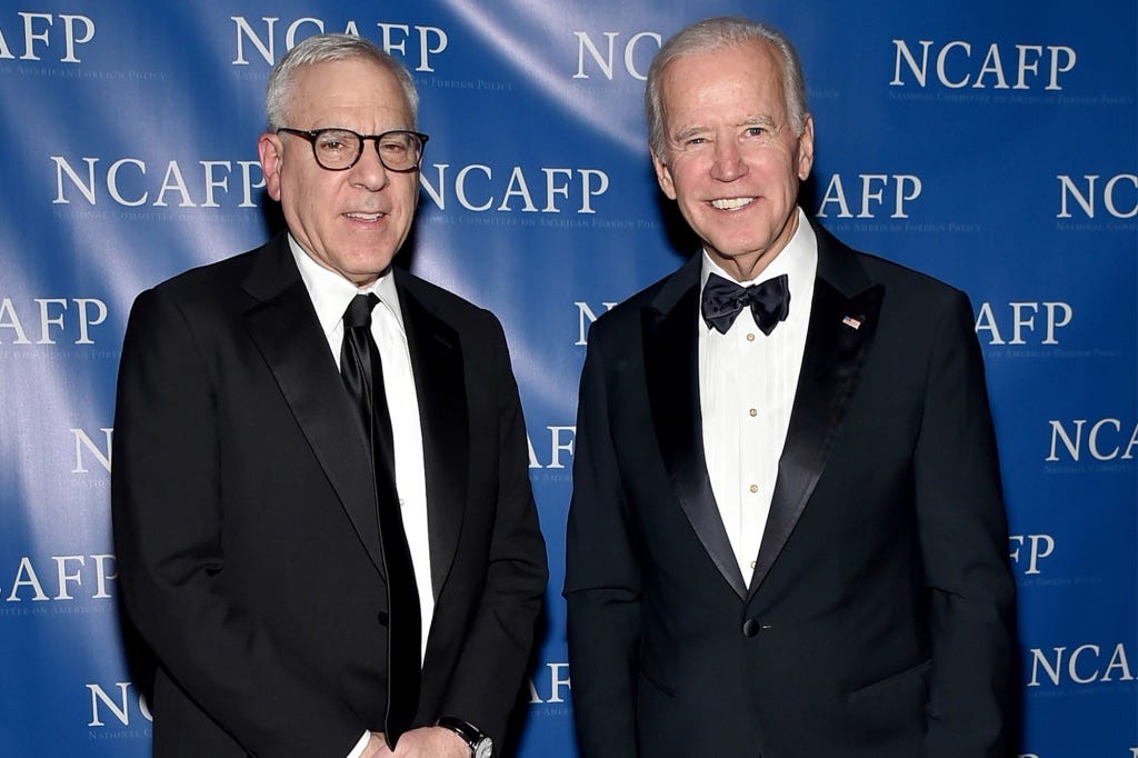 A photo of Carlyle Group co-founder David Rubenstein with President Joe Biden.