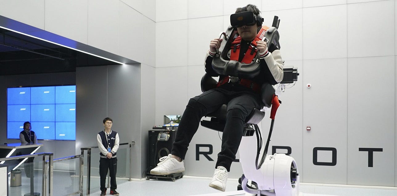 Man riding virtual reality roller coaster in VR theme part at nanchang china