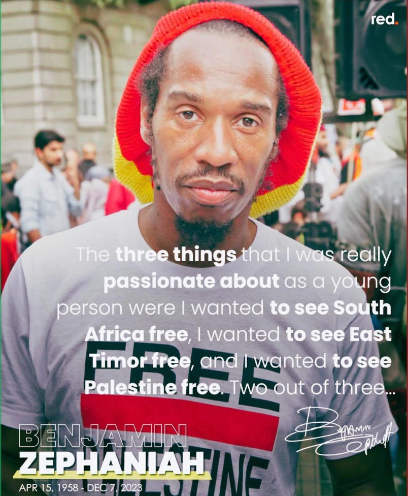Description by TL: Image of Benjamin Zephaniah with his locks covered with a red yellow and green knit locks cover while at a protest wearing a FREE PALESTINE shirt. Large speakers and other protesters can be seen in the background. Image has the quote from Zephaniah’s book Rasta Time in Palestine that says:  The three things that I was really passionate about as a young person where I wanted to see South Africa free, I wanted to see East more free, and I wanted to see Palestine free. Two out of three…  Benjamin Zephaniah April 15, 1958 - Dec. 7, 2023 Zephaniah’s signature is imposed on the image.