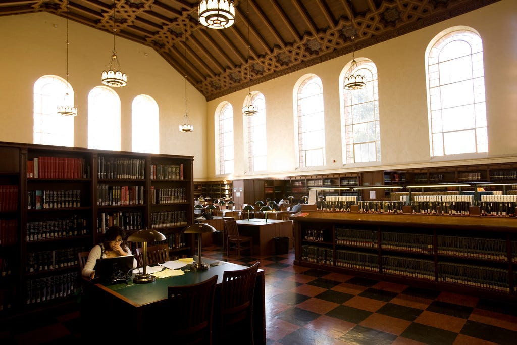 Inside Powell Library's Main Reading Room —- Photo Credit: Stephanie Diani  – UCLA Bruin Blog