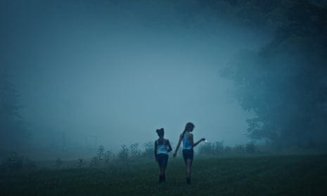 two children in a misty scene