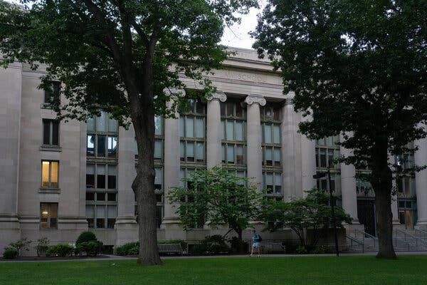 The Harvard Law School campus, with two large trees in the front.