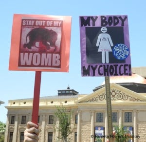 Protest signs from the War on Women march and rally at the Arizona State Capitol in 2012.