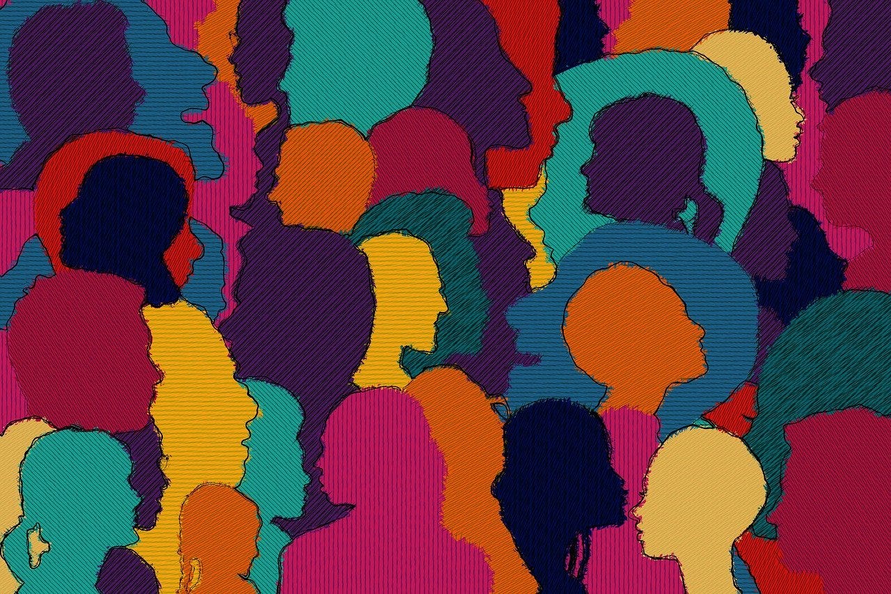 drawing of a variety of people's heads, facing in different directions and drawn in bold colors