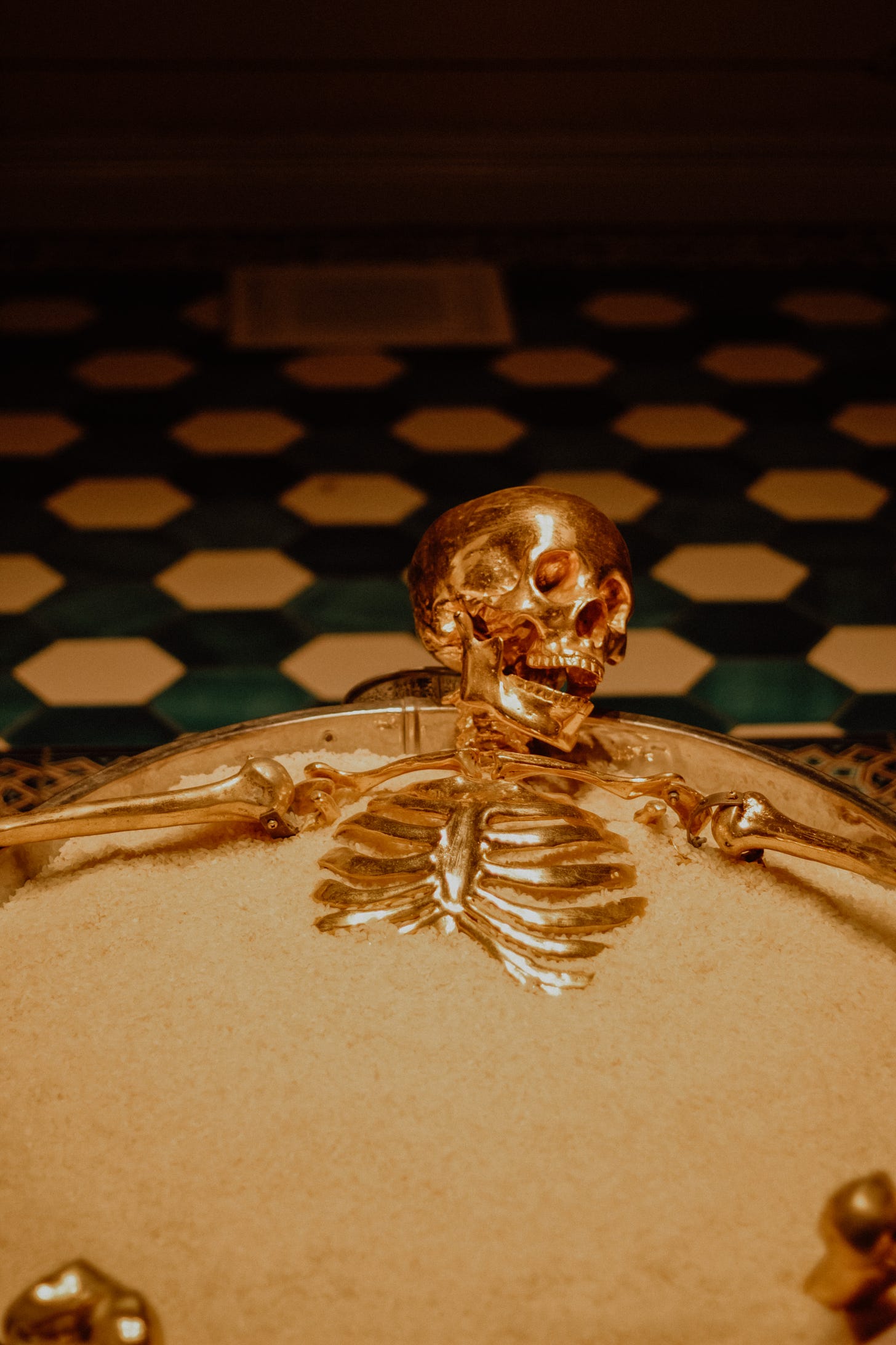 Free Gold Sugar-Bowl with Skeleton Figurine Stock Photo